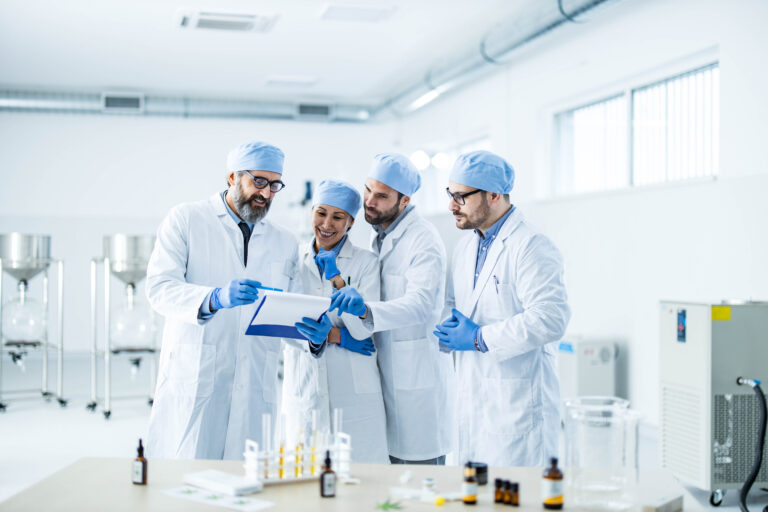 a group of scientists looking at a report
