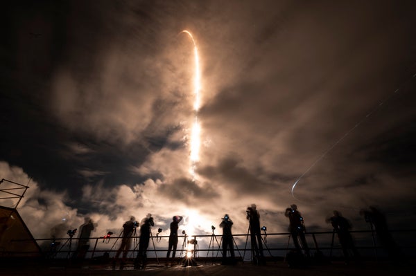 Polaris Dawn Mission Launch with line of photographers shooting