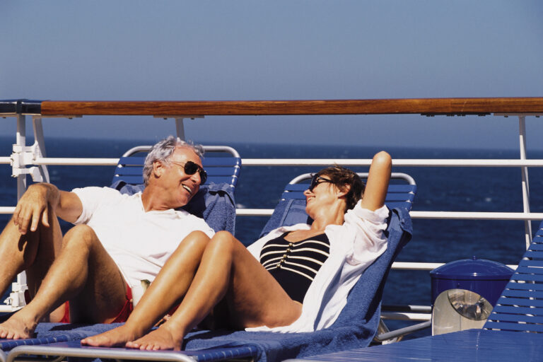 24 01 16 a couple sitting on the deck of a cruise ship mf dload gettyimages 78458446 1200x800 5b2df79