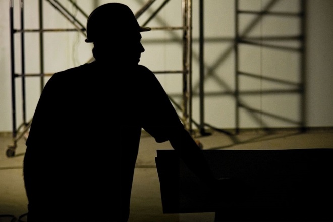 Modern slavery construction worker silhouette 660