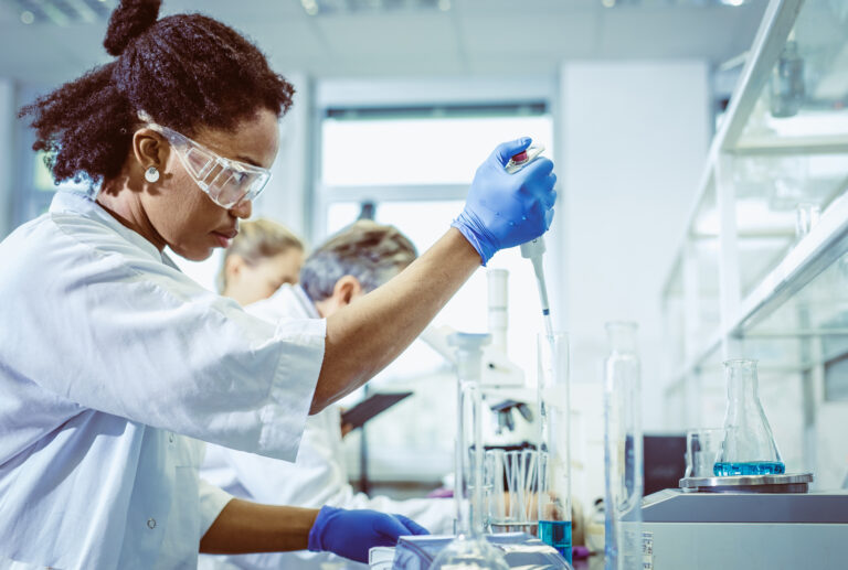 scientist mixing chemicals with a pipette2