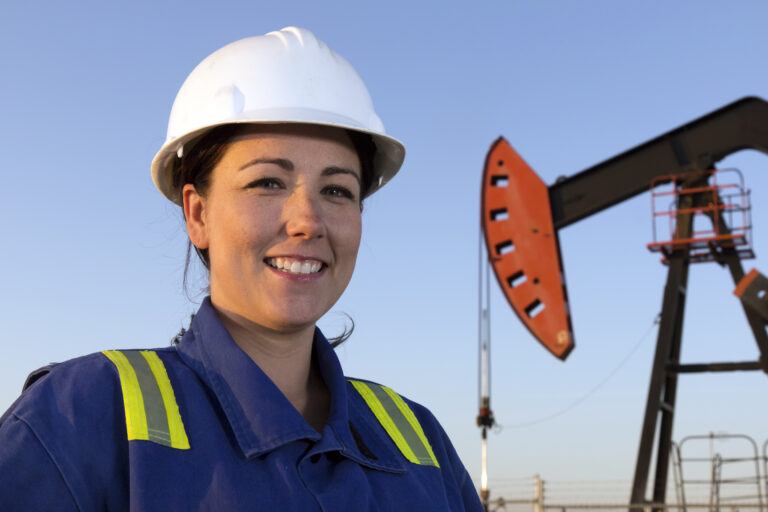 23 10 31 a person in protective gear with an oil well in the background mf dload