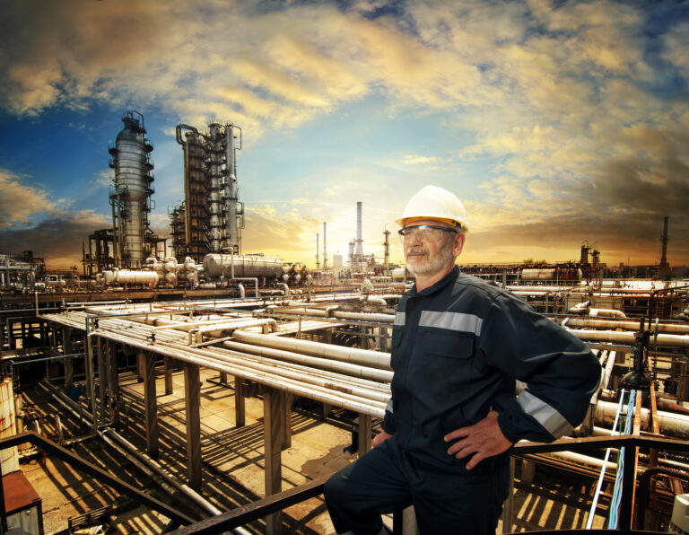 a person standing next to an energy facility