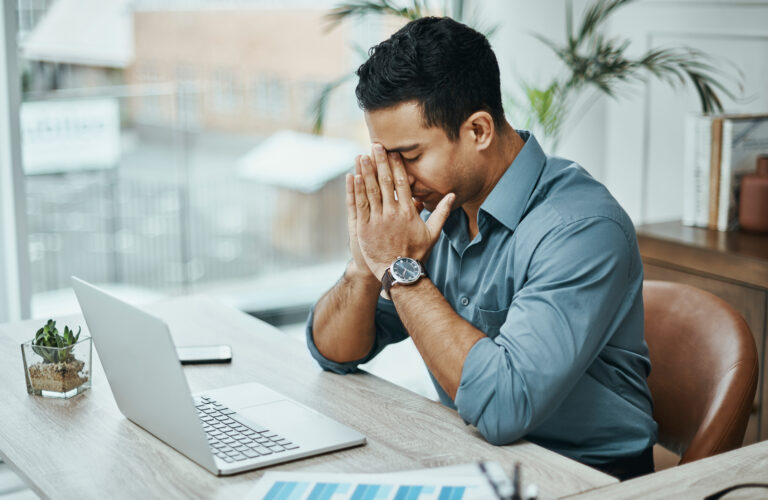 young man worried laptop