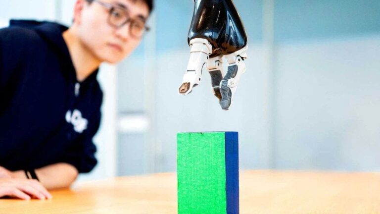 2 ai enables paralyzed man to control robotic arm with brain signals