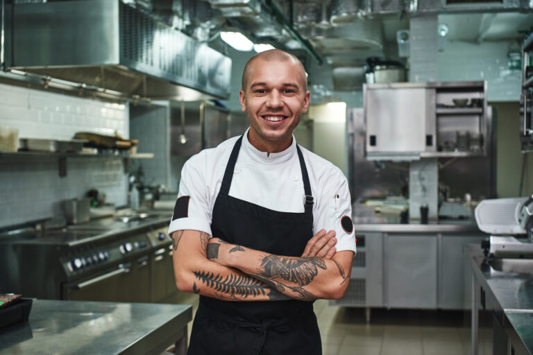 getty cheerful young chef with tattoos
