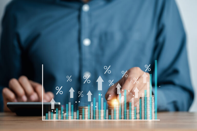 investor calculating stock returns on a calculator