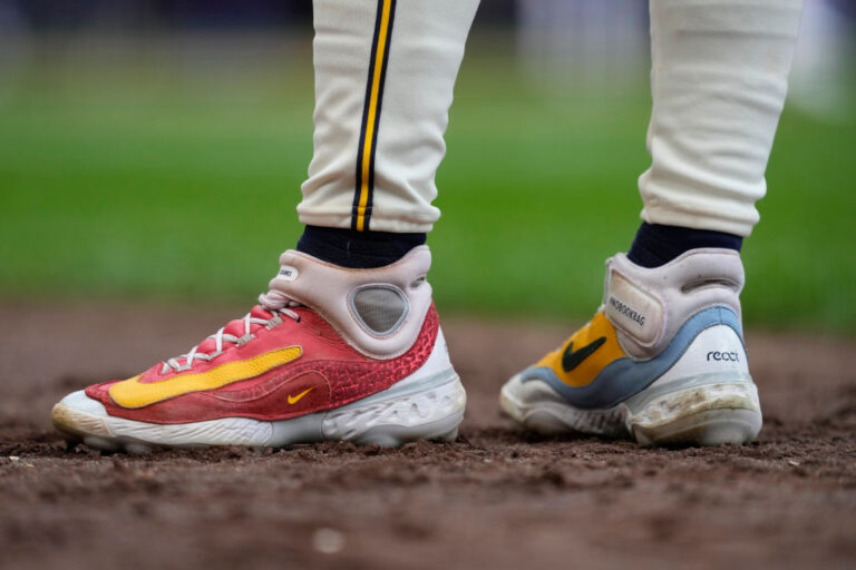 nike shoes on baseball field with logo nke 1