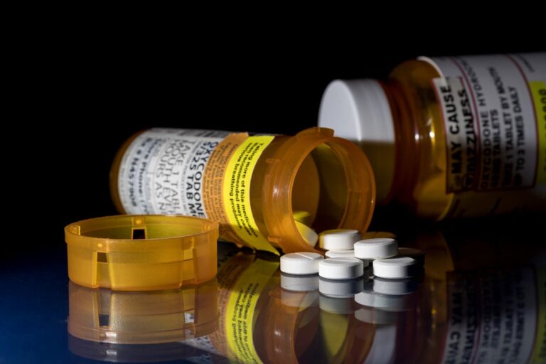 oxycodone prescription bottles and tablets